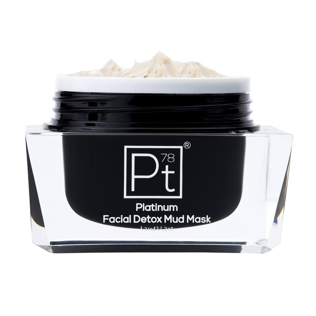 Close-up of Platinum Facial Detox Mud Mask in a black glass jar with chrome lid, showing creamy mineral mud texture for deep pore cleansing and skin detox.