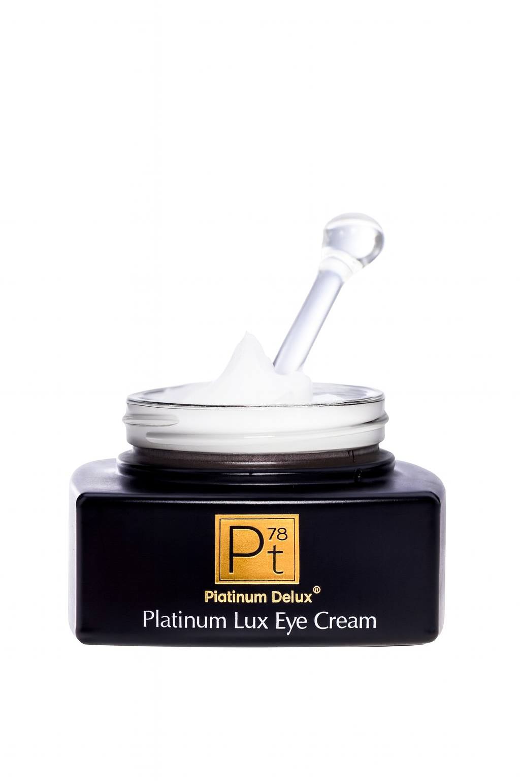 
5K ultra-HD close-up image of an open Platinum Delux® Platinum Lux Eye Cream jar with a clear applicator lifting a dollop of rich white cream, premium anti-aging formula for dark circles, puffiness, and wrinkle reduction.